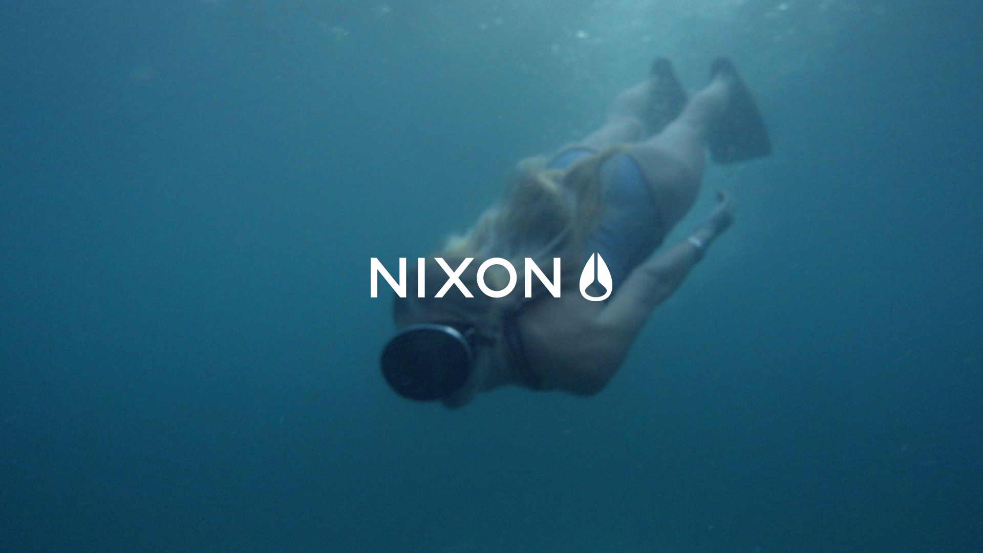 A woman snorkling for Nixon by Voda films