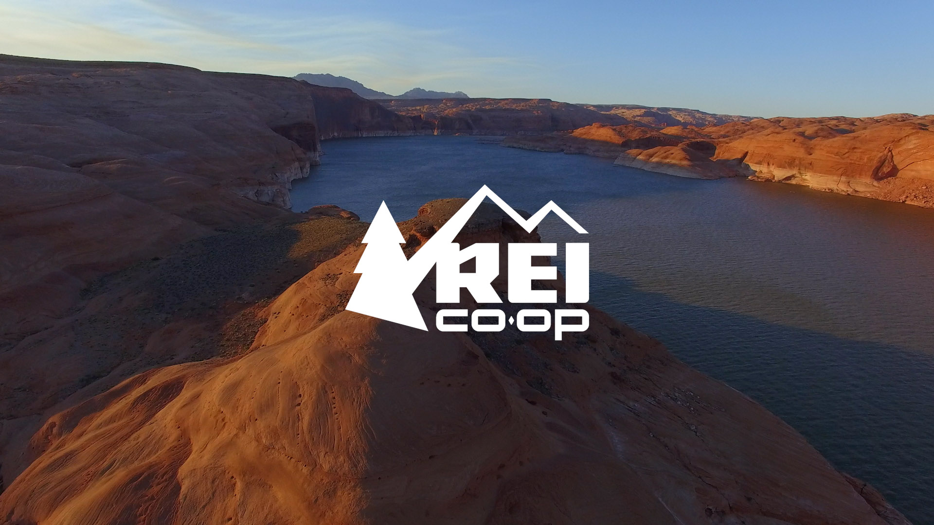 REI logo on top of river photo.