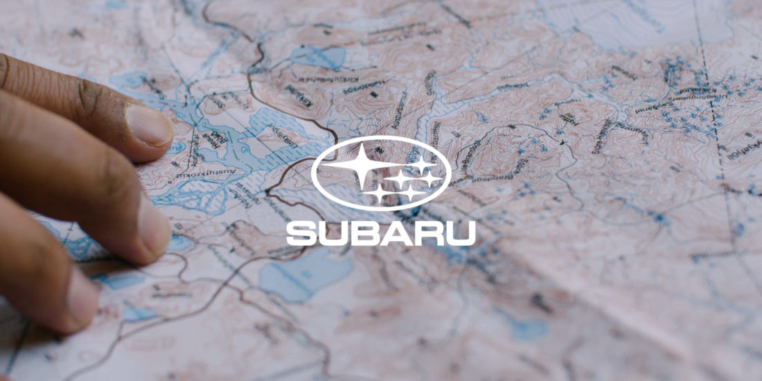 Subaru logo on top of a map
